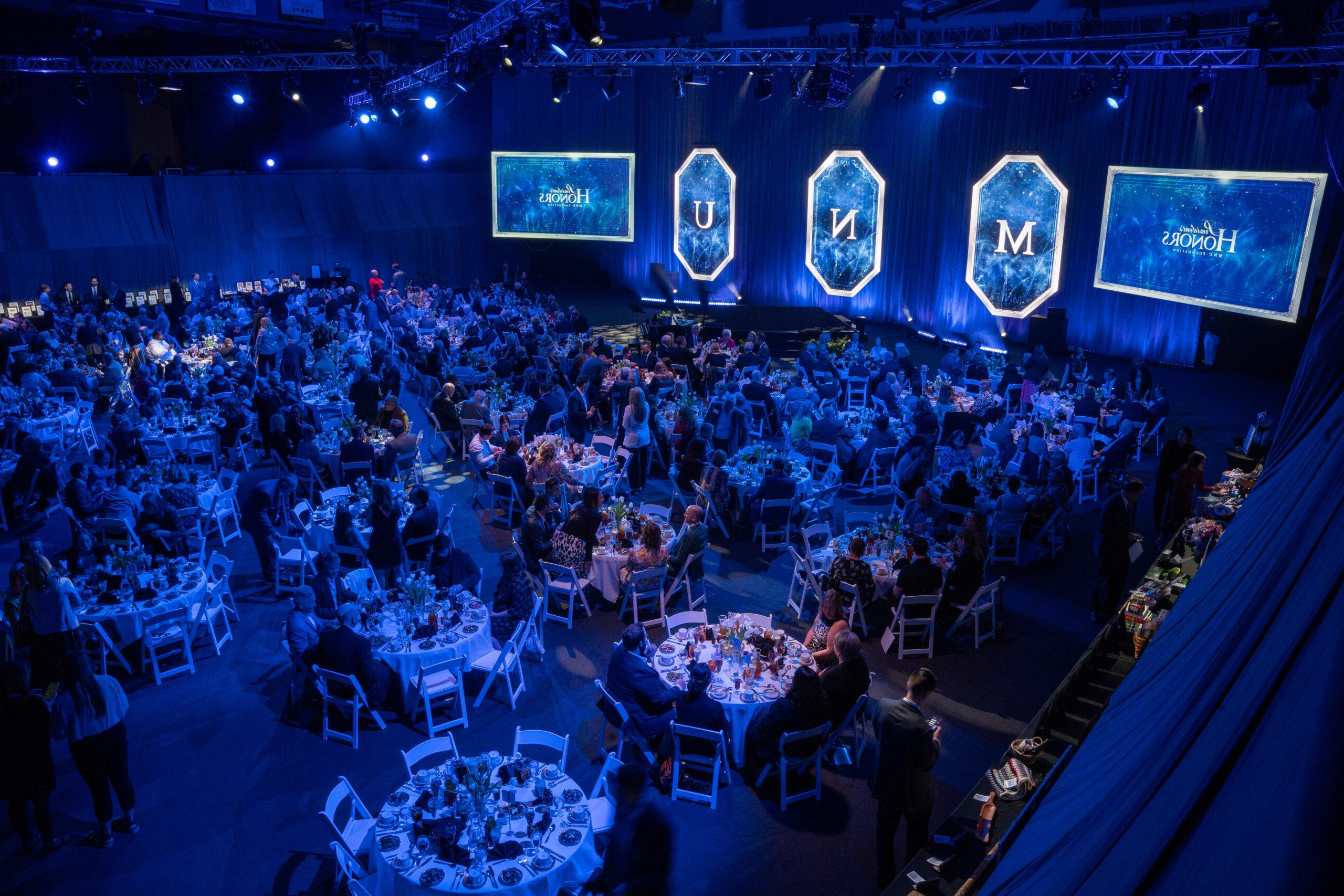 Main floor with guests at tables, 2024 President's Honors